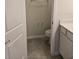 Powder room featuring tile floors, and a vanity cabinet with a toilet for added convenience at 11151 Rising Sun St, Orlando, FL 32829