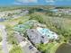 Overhead view of the community clubhouse with tennis courts, pool, and parking at 14209 Lake Live Oak Dr, Orlando, FL 32828