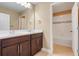 Bathroom featuring a double sink vanity and separate tub at 14315 Crestavista Ave, Clermont, FL 34714