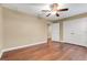 Spacious bedroom with hardwood floors, ceiling fan and double door closet at 14315 Crestavista Ave, Clermont, FL 34714