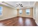 Spacious main bedroom featuring hardwood floors, natural light, and tray ceilings at 14315 Crestavista Ave, Clermont, FL 34714