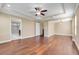 Spacious main bedroom featuring hardwood floors, a walk-in closet, and an en-suite bathroom at 14315 Crestavista Ave, Clermont, FL 34714