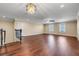 Bonus room with beautiful hardwood floors, a decorative chandelier, and two bright windows at 14315 Crestavista Ave, Clermont, FL 34714