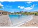 A stunning community pool featuring a zero entry, splash pad, and plenty of lounge seating at 14315 Crestavista Ave, Clermont, FL 34714