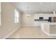 Bright dining area with chandelier, neutral walls, and tile flooring next to the kitchen at 14315 Crestavista Ave, Clermont, FL 34714