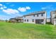 Exterior view of the home and backyard with covered screened lanai at 14315 Crestavista Ave, Clermont, FL 34714