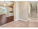 Bright foyer featuring tile flooring, staircase, and view into the living area at 14315 Crestavista Ave, Clermont, FL 34714