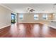 Bright and airy living room features hardwood floors, recessed lighting, and sliding glass doors at 14315 Crestavista Ave, Clermont, FL 34714