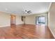 Expansive living room with hardwood floors, staircase, and sliding doors to the patio at 14315 Crestavista Ave, Clermont, FL 34714