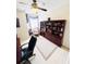 Bright office with ceiling fan and large dark shelving with CEO book at 14339 Windchime Ln, Orlando, FL 32837