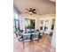 Covered patio with ceiling fan and stylish outdoor furniture at 14339 Windchime Ln, Orlando, FL 32837