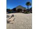 Community pool area featuring lounge chairs and pool house with brick pavers under a clear blue sky at 14339 Windchime Ln, Orlando, FL 32837