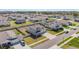 Aerial view of a new construction two-story home with three-car garage in a suburban neighborhood at 14418 Bayuk Way, Winter Garden, FL 34787