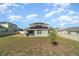 A spacious backyard with newly installed solar panels on the roof at 14418 Bayuk Way, Winter Garden, FL 34787