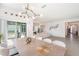 Bright dining room area featuring modern lighting fixture and sliding door to patio at 14418 Bayuk Way, Winter Garden, FL 34787