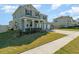 A cozy two-story house with a manicured lawn and a convenient three-car garage at 14418 Bayuk Way, Winter Garden, FL 34787