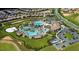 An aerial view shows a community pool with resort-style amenities and lush landscaping at 1555 Flange Dr, Davenport, FL 33896