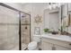 Modern bathroom with walk-in shower, decorative wall art, and well-lit vanity, offering a serene atmosphere at 16089 Parkwyn St, Winter Garden, FL 34787