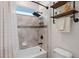 Modern bathroom with a tiled shower and stylish shelving at 16089 Parkwyn St, Winter Garden, FL 34787