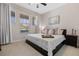 Comfortable bedroom with natural light, plush bedding, and modern decor at 16089 Parkwyn St, Winter Garden, FL 34787