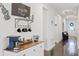 Elegant entryway showcasing a coffee station and stylish decor leading into the home at 16089 Parkwyn St, Winter Garden, FL 34787