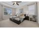 Inviting main bedroom with tray ceilings, neutral decor, and large windows for natural light at 16089 Parkwyn St, Winter Garden, FL 34787