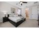 Relaxing main bedroom with a tray ceiling, a walk-in closet, and an ensuite bathroom at 16089 Parkwyn St, Winter Garden, FL 34787