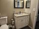 Bathroom featuring a granite vanity, modern fixtures, and convenient toilet placement at 162 Lago Vista Blvd, Casselberry, FL 32707