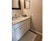 Well-lit bathroom with granite countertop, white vanity, and modern fixtures at 162 Lago Vista Blvd, Casselberry, FL 32707