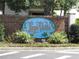 Brick sign with blue Lago Vista logo and manicured landscaping at 162 Lago Vista Blvd, Casselberry, FL 32707