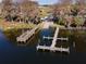 Aerial view of a wooden dock offering waterfront access and scenic views for community residents at 162 Lago Vista Blvd, Casselberry, FL 32707