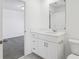 Bathroom with modern fixtures, a vanity with drawers, and a toilet at 16450 Bird Of Paradise Ave, Clermont, FL 34714