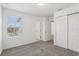 Bright bedroom featuring a window and a closet with sliding doors at 16450 Bird Of Paradise Ave, Clermont, FL 34714
