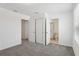 Bedroom featuring a closet, ensuite bath, and neutral carpet at 16450 Bird Of Paradise Ave, Clermont, FL 34714