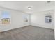 A spacious bedroom with carpet and large windows for natural light at 16450 Bird Of Paradise Ave, Clermont, FL 34714