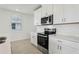 Beautiful kitchen with quartz countertops, stainless steel appliances and a modern design at 16450 Bird Of Paradise Ave, Clermont, FL 34714
