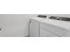 Well-lit laundry area with a side-by-side washer and dryer at 16450 Bird Of Paradise Ave, Clermont, FL 34714