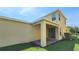 This home includes a covered patio and a well-maintained lawn at 16749 Harper Cove Dr, Winter Garden, FL 34787