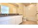 Bathroom featuring double vanity, granite countertops, and a bath and shower combo at 16749 Harper Cove Dr, Winter Garden, FL 34787