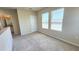 Upstairs bedroom featuring carpet flooring and natural light, located on the second floor at 16749 Harper Cove Dr, Winter Garden, FL 34787
