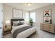 Well-decorated bedroom featuring neutral decor, a comfortable bed, and ample natural light for a soothing atmosphere at 16749 Harper Cove Dr, Winter Garden, FL 34787
