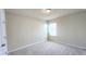 Cozy bedroom with carpet flooring, ample natural light, and neutral paint at 16749 Harper Cove Dr, Winter Garden, FL 34787