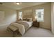 Cozy bedroom showcasing a queen-sized bed, side tables with lamps, and soft, neutral decor for a relaxing retreat at 16749 Harper Cove Dr, Winter Garden, FL 34787