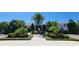 Beautiful community center featuring lush landscaping and a welcoming entrance at 16749 Harper Cove Dr, Winter Garden, FL 34787