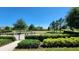 Scenic community dog park offers ample space for furry friends to play and socialize, with lush landscaping under a clear sky at 16749 Harper Cove Dr, Winter Garden, FL 34787