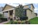 Inviting two-story home featuring manicured landscaping and a welcoming front porch at 16749 Harper Cove Dr, Winter Garden, FL 34787