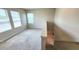 Bright loft area with carpet flooring and natural light, located on the second floor at 16749 Harper Cove Dr, Winter Garden, FL 34787