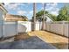 Fenced backyard with a patio and grassy area at 1709 Winter Green Blvd, Winter Park, FL 32792