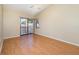 Bedroom with high ceilings, ceiling fan, wood floors and sliding doors to balcony at 1709 Winter Green Blvd, Winter Park, FL 32792