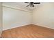 Upstairs loft/bedroom with vaulted ceilings, ceiling fan and hardwood floor at 1709 Winter Green Blvd, Winter Park, FL 32792